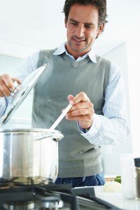 Portrait of a mature man preparing food in the kitchen
