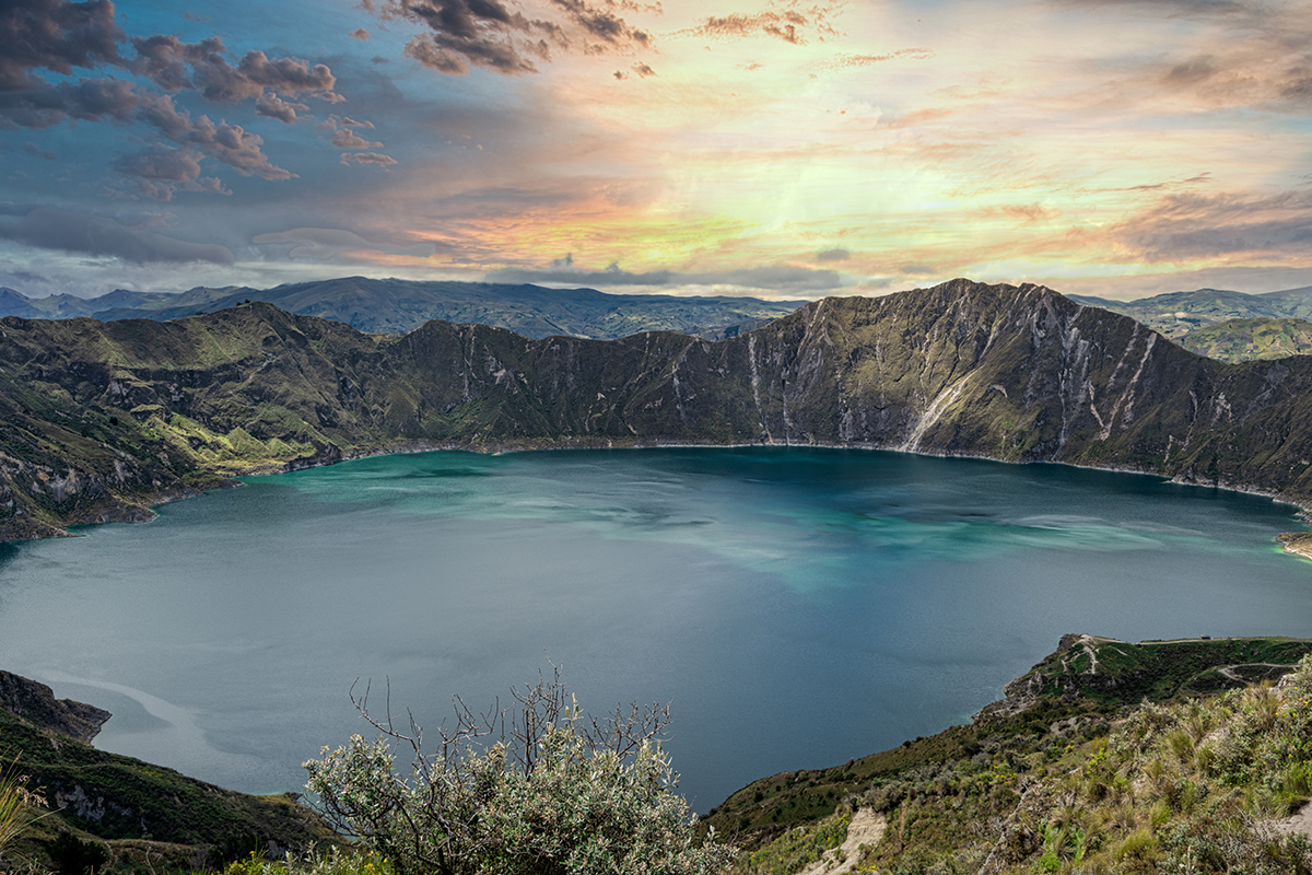 Amazing sunset at Quilotoa lake, located inside a volcano crater. Ecuador, South America. Panoramic photography