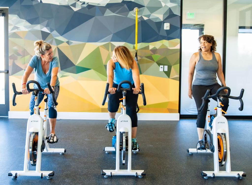 55+ Active Adult OakwoodLife spin class in fitness center