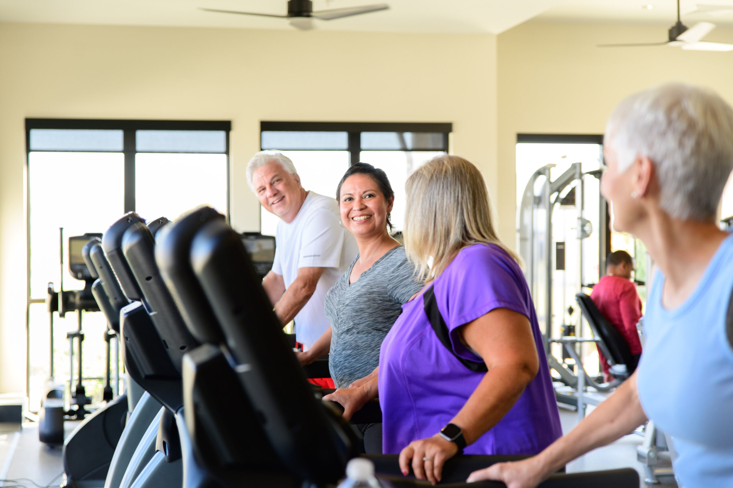 55+ Active Adult OakwoodLife treadmill group in fitness center