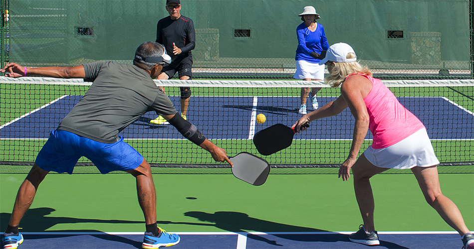 Couples playing Pickleball